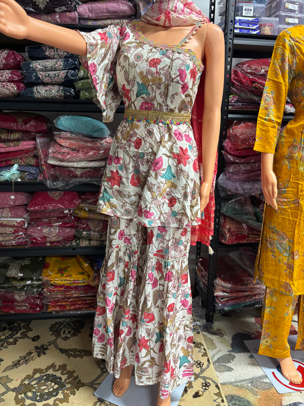Elegant 3-piece kurta palazzo set featuring asymmetrical sleeves for a modern twist on traditional wear