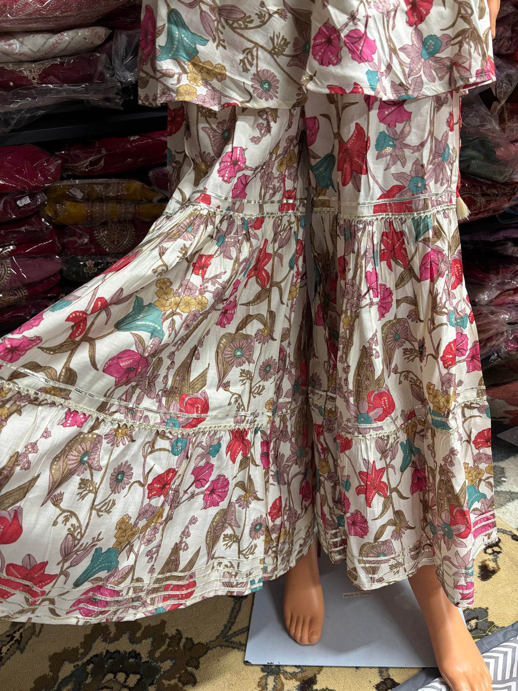 Elegant 3-piece kurta palazzo set featuring asymmetrical sleeves for a modern twist on traditional wear