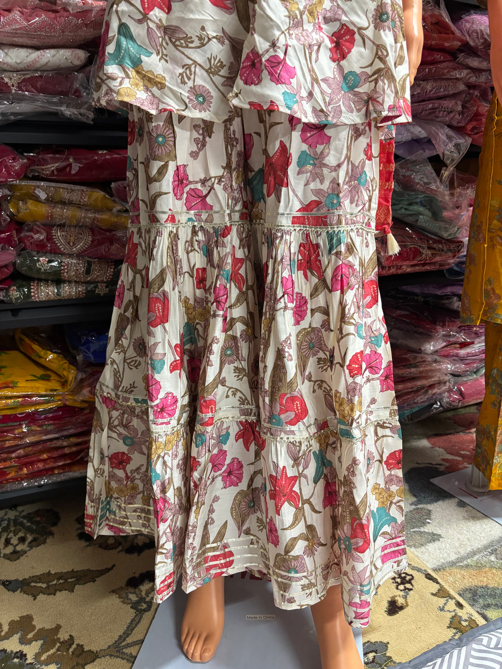 Elegant 3-piece kurta palazzo set featuring asymmetrical sleeves for a modern twist on traditional wear